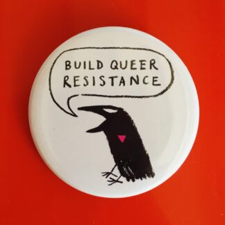 a badge with a crow saying build queer resitance pink triangle