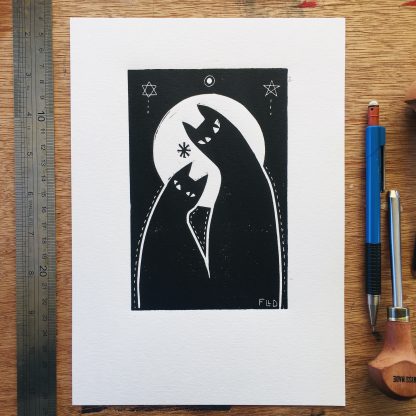 Stylised black cats in front of a moon lino art print