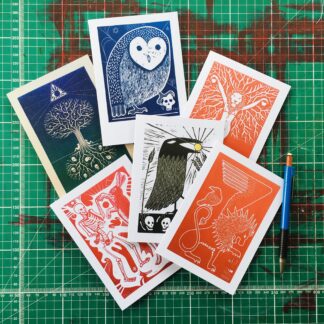 A6 notecards with trans queer and pagan linoprint designs Wales