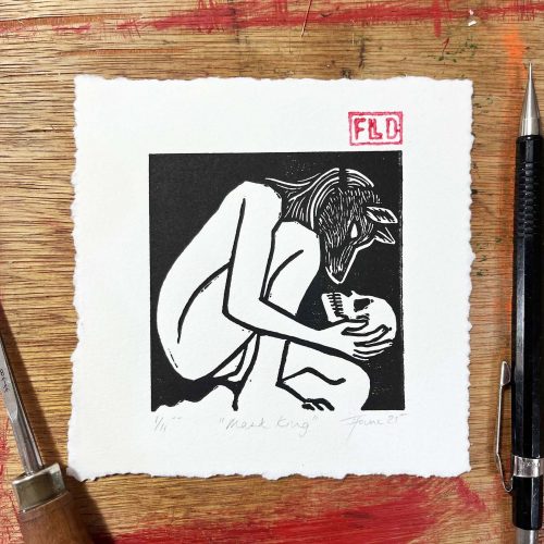 queer autistic fine art - a person wearing a fox mask cradles a human skull